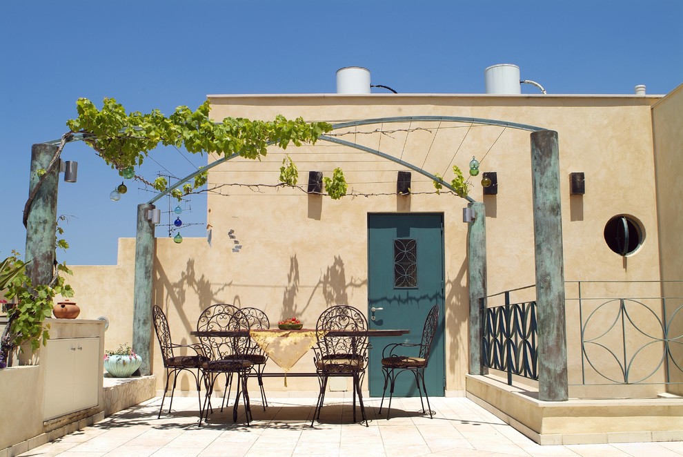 Design ideas for a mediterranean house exterior in Tel Aviv.