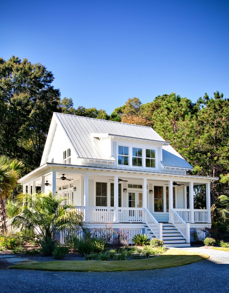 Example of a small classic white two-story concrete fiberboard exterior home design in Charleston with a metal roof