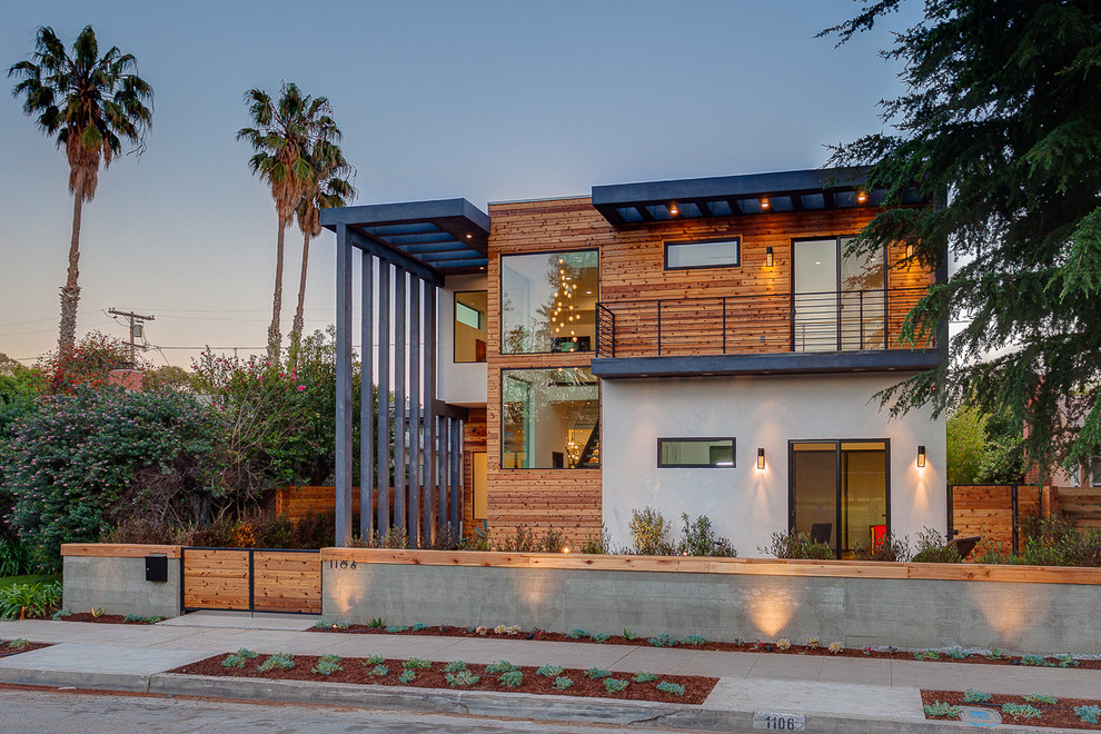 Ejemplo de fachada de casa multicolor contemporánea de dos plantas con revestimientos combinados y tejado plano
