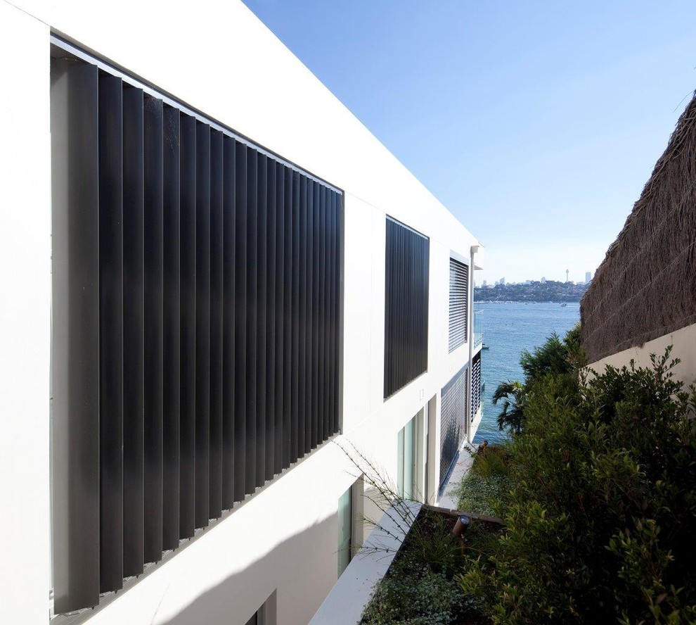 Example of a minimalist exterior home design in Sydney