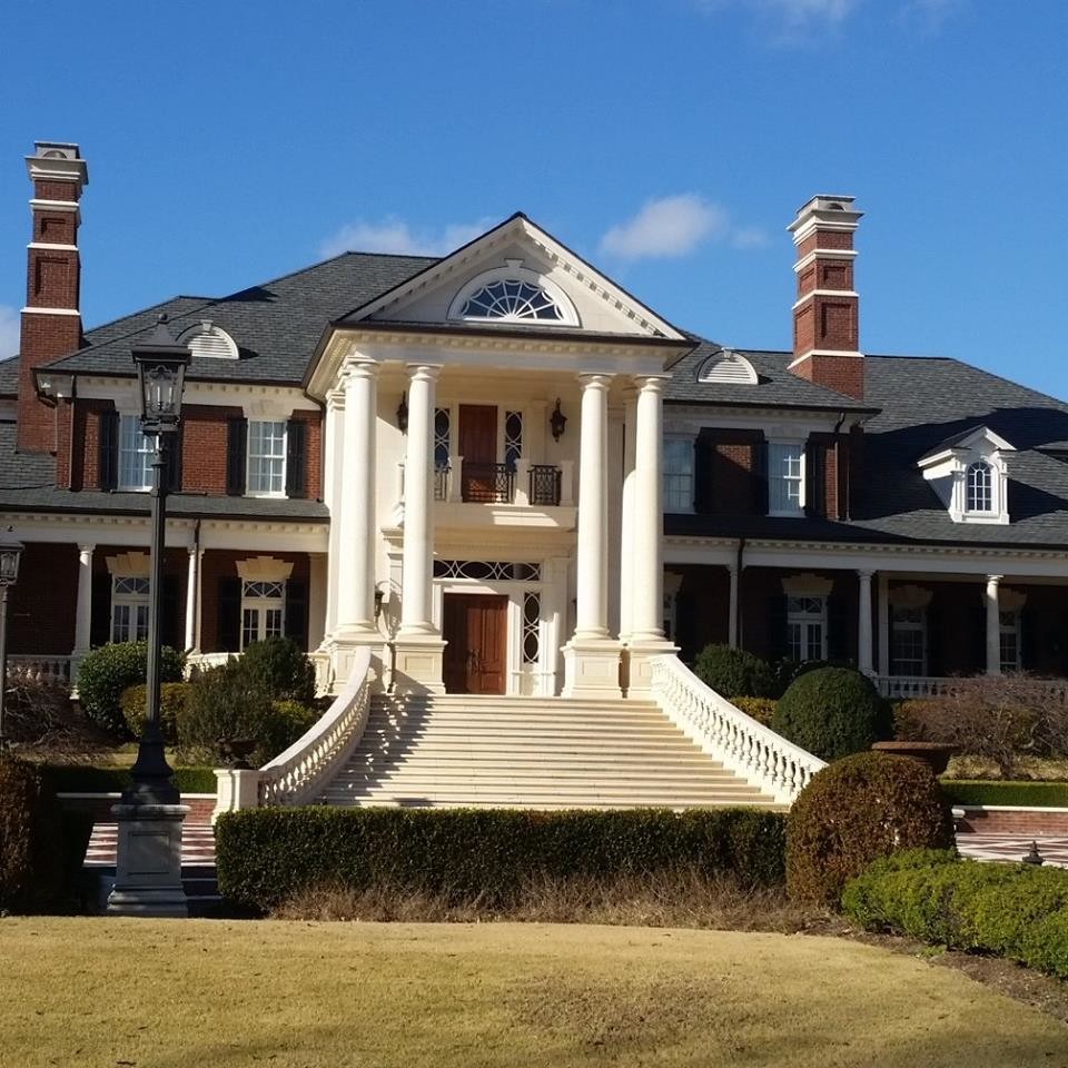 Inspiration for a huge victorian three-story brick exterior home remodel in Atlanta with a mixed material roof