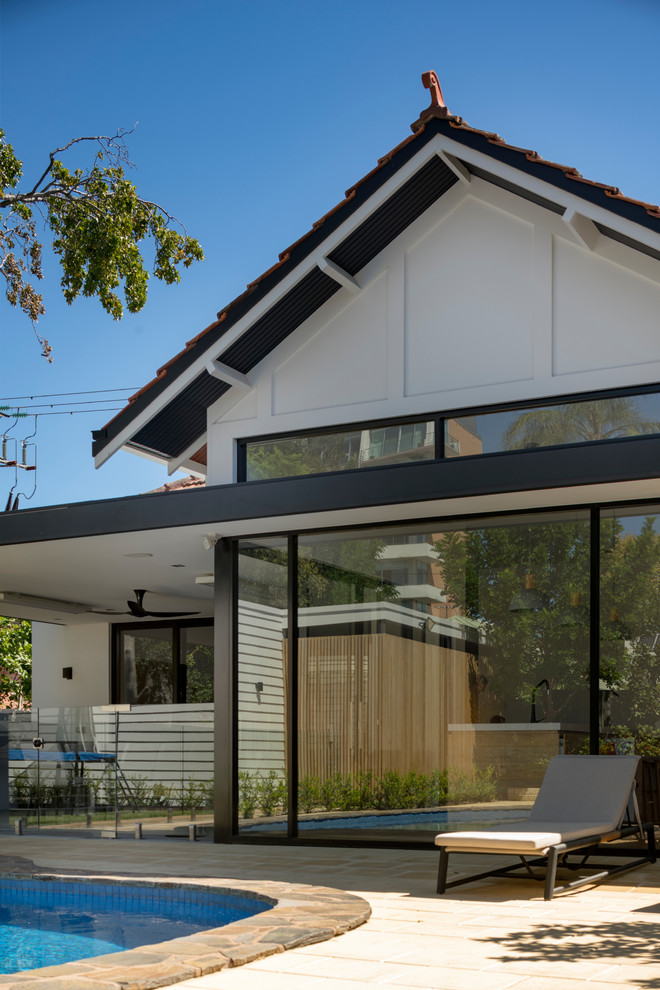 Inspiration for a medium sized and white retro bungalow detached house in Adelaide with a pitched roof and a tiled roof.