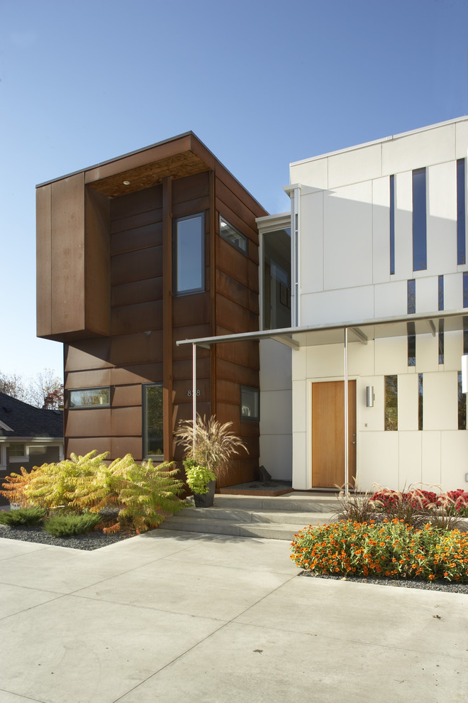 Example of a minimalist two-story mixed siding exterior home design in Minneapolis