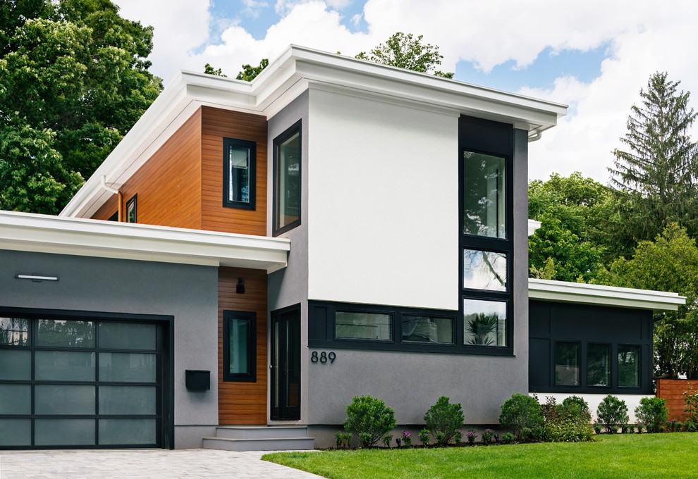 Idee per la facciata di una casa contemporanea a due piani con tetto piano