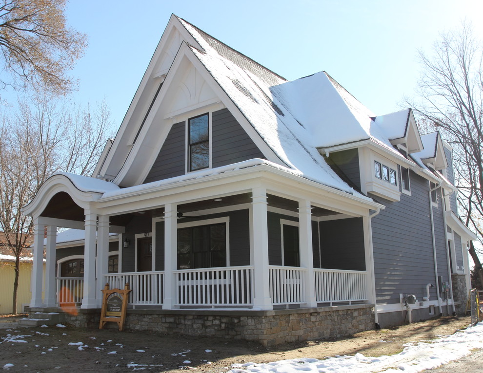 Inspiration for a mid-sized victorian gray two-story stone gable roof remodel in Detroit