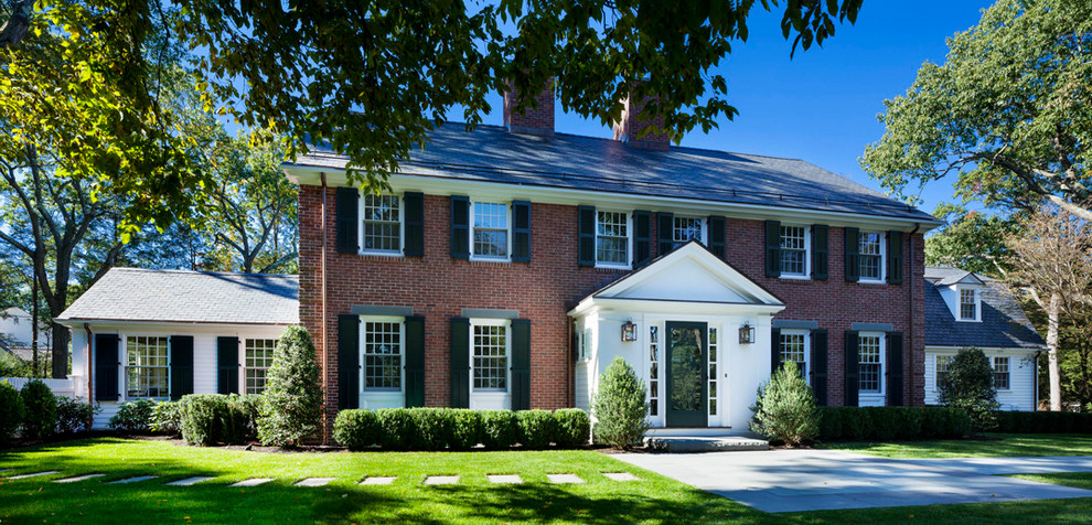 Inspiration for a large classic two floor brick house exterior in Boston.