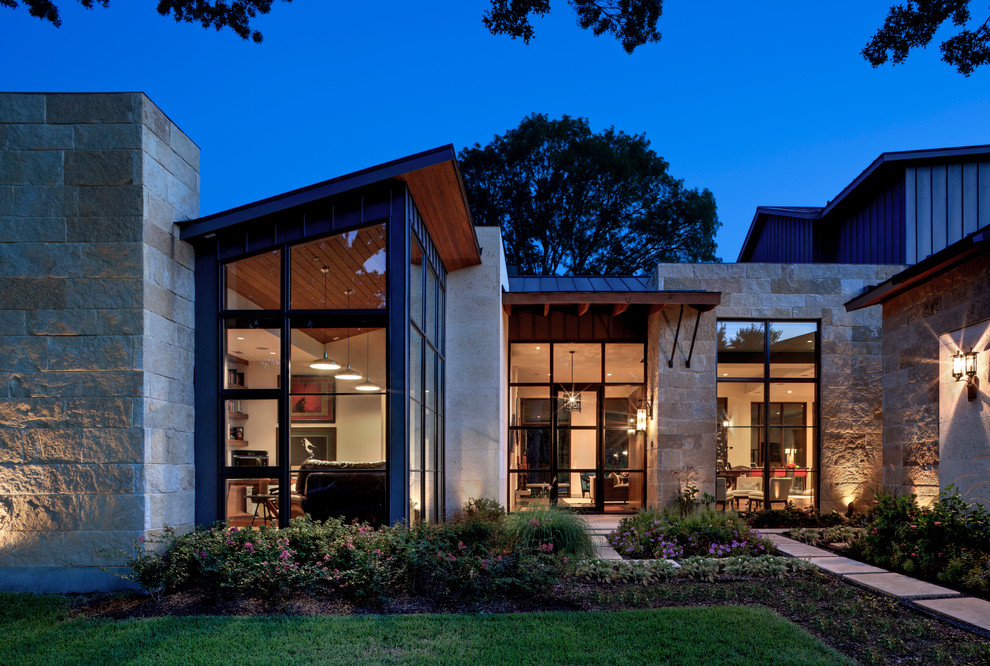 Design ideas for a contemporary house exterior in Dallas with mixed cladding.