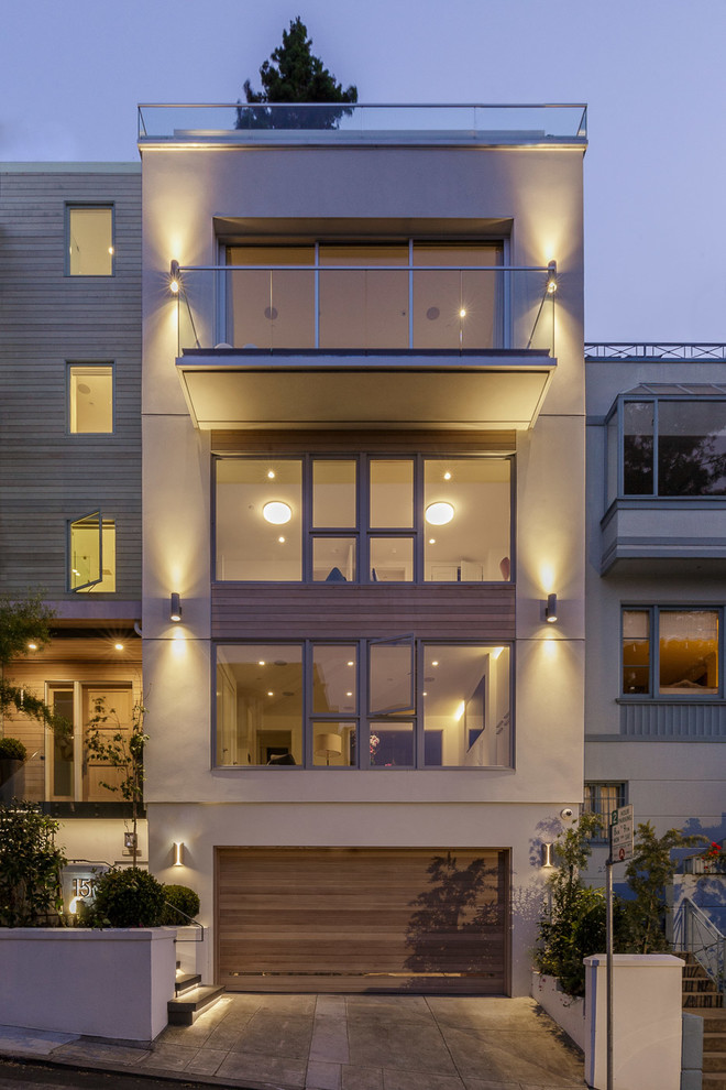 Ejemplo de fachada de casa pareada beige contemporánea de tres plantas con tejado plano