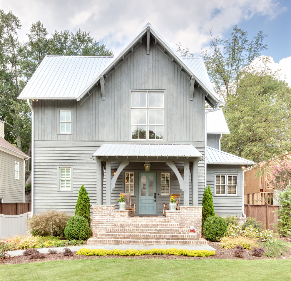 Design ideas for a gey and medium sized farmhouse two floor house exterior in Atlanta with a pitched roof and wood cladding.