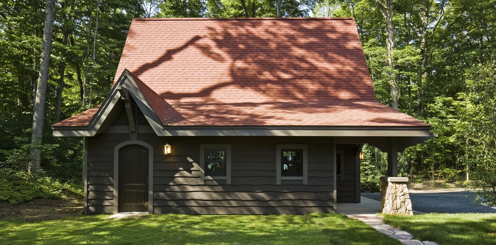 Small rustic exterior home idea in Minneapolis with a red roof