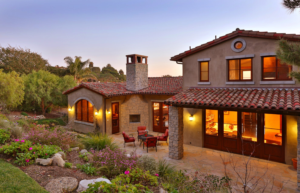 Tuscan beige two-story exterior home photo in Los Angeles