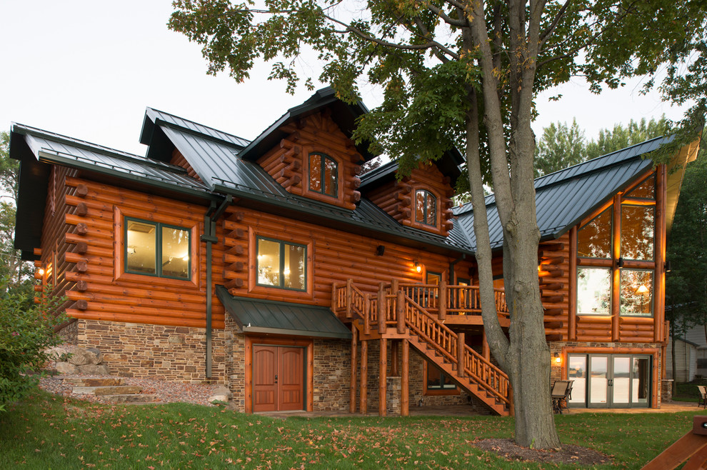 Inspiration for a rustic two-story wood exterior home remodel in Other