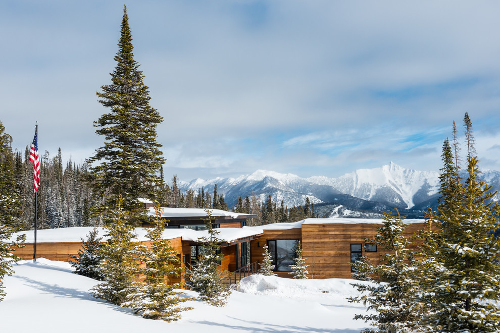 Rustic wood flat roof idea in Other