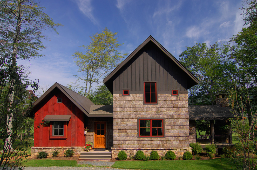 Rural two floor house exterior in Charlotte with wood cladding.