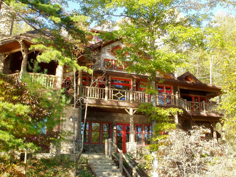 Example of a mountain style exterior home design in Atlanta with a hip roof