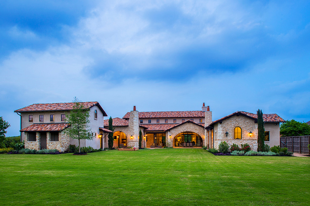 Example of a mountain style stone exterior home design in Austin