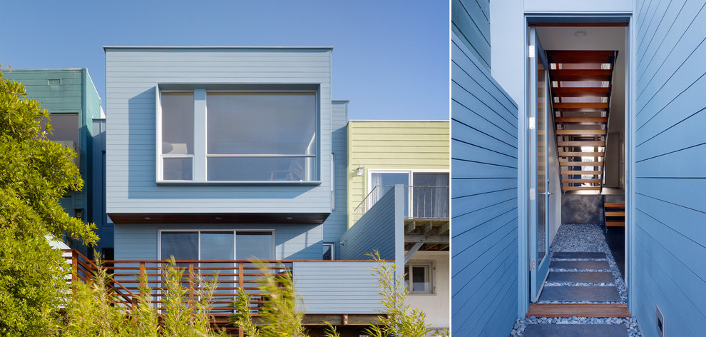 Photo of a medium sized and blue modern two floor house exterior in San Francisco with wood cladding and a flat roof.