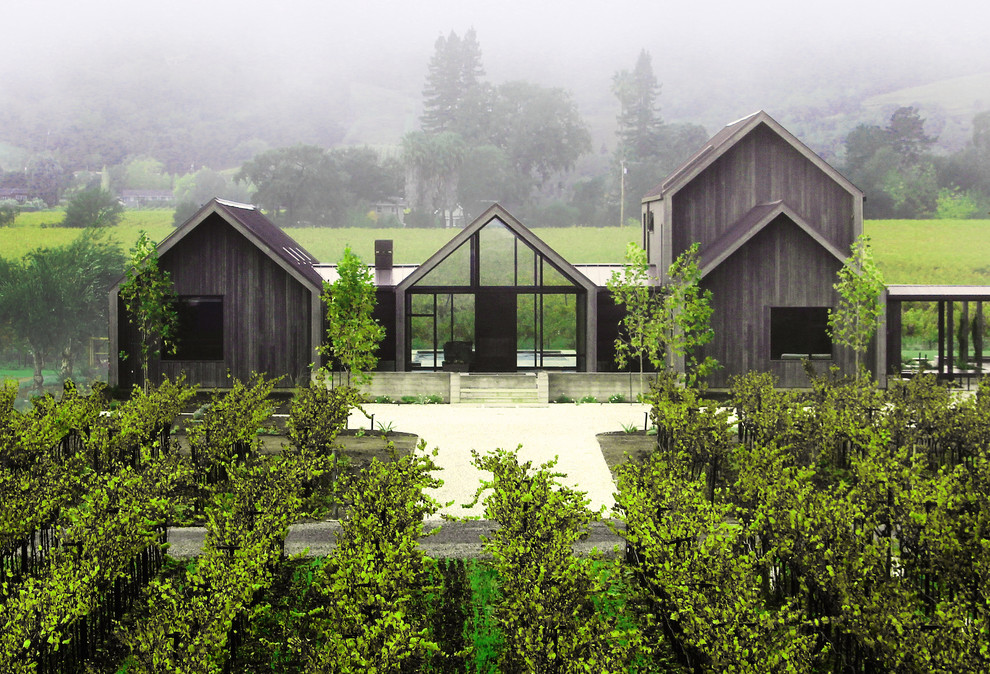 Ispirazione per la villa grande multicolore moderna a due piani con rivestimento in legno, tetto a capanna e copertura in metallo o lamiera