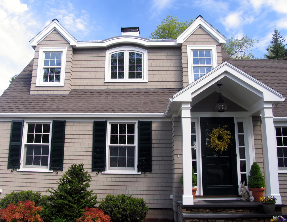 Example of a mid-sized classic gray two-story wood gable roof design in Boston