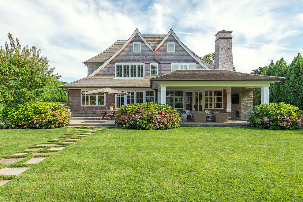 Example of a large classic gray two-story wood exterior home design in New York with a shingle roof
