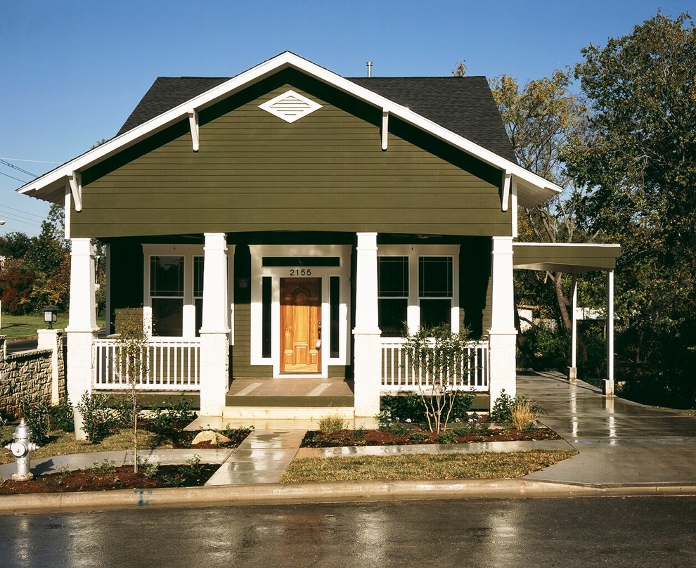 Inspiration for a small and green classic bungalow house exterior in Austin with wood cladding and a pitched roof.