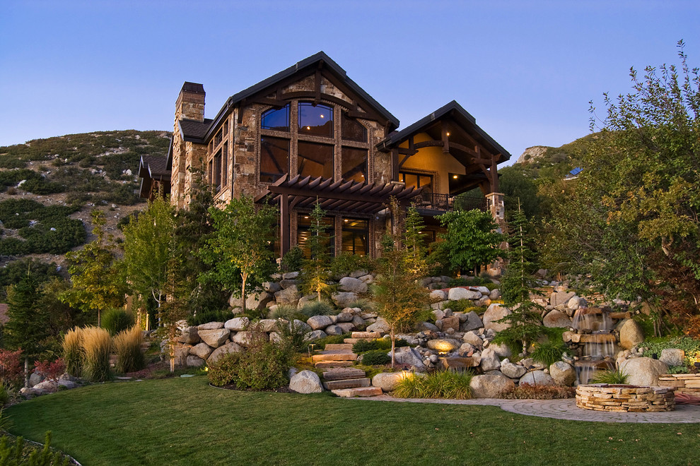 Inspiration for a rustic two-story stone exterior home remodel in Salt Lake City