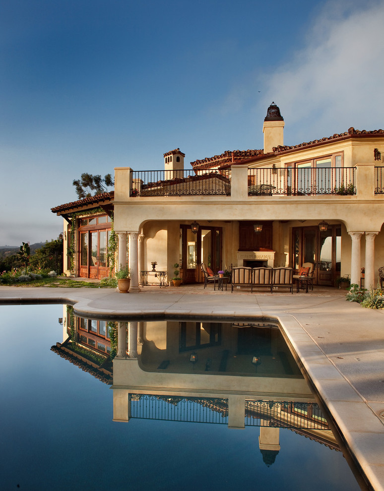 Example of a tuscan two-story exterior home design in San Diego