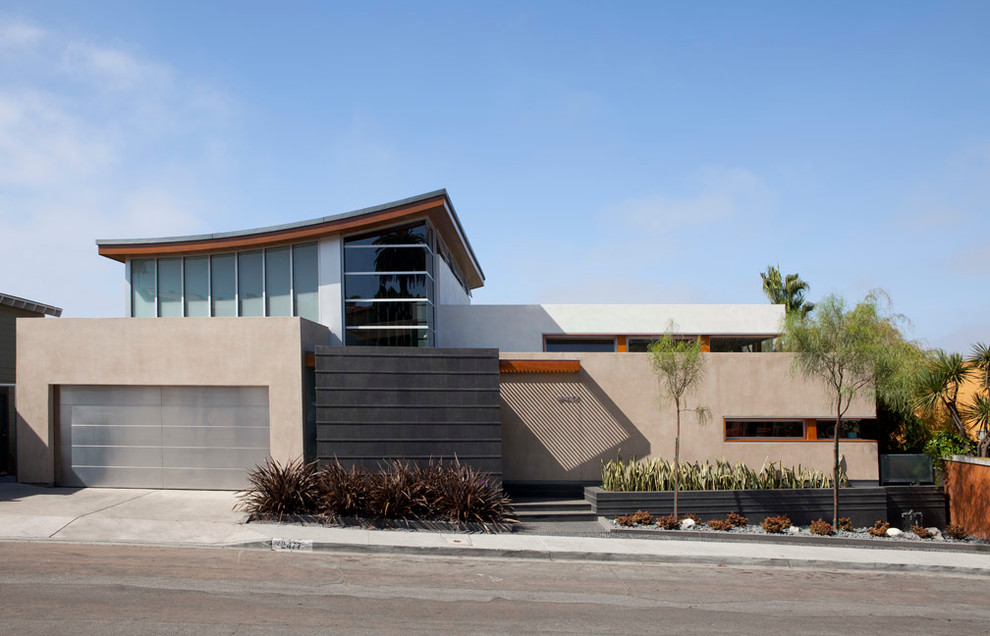 Photo of a large contemporary two floor house exterior in San Diego with mixed cladding.