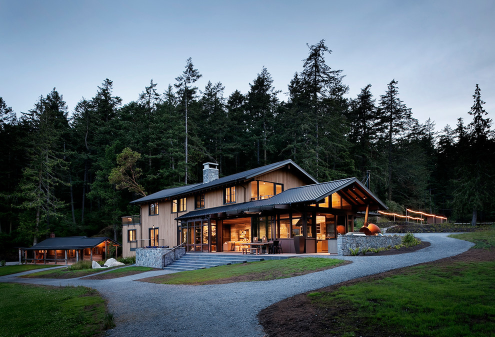 Inspiration for a large rustic three-story exterior home remodel in Seattle