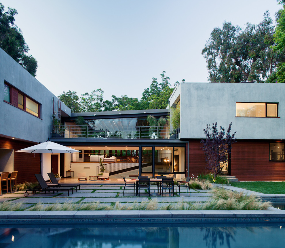 Inspiration for a contemporary house exterior in Los Angeles with wood cladding.