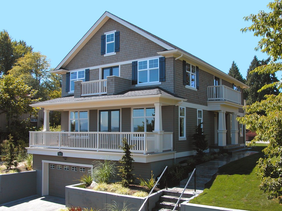 Medium sized traditional house exterior in Seattle with three floors and wood cladding.