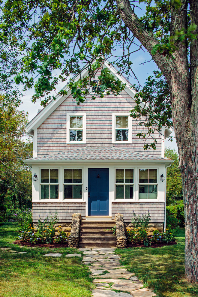 Coastal beige two-story wood exterior home idea in Boston with a shingle roof