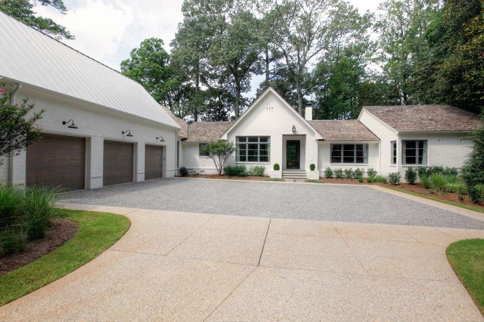 This is an example of a white traditional bungalow house exterior in Atlanta.