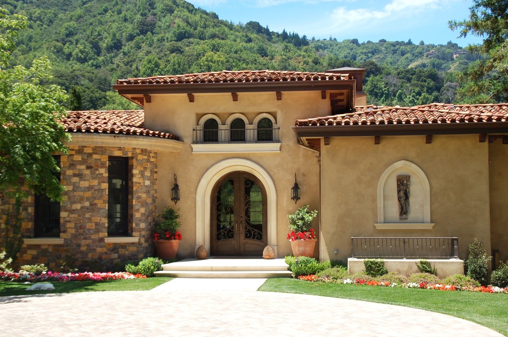 This is an example of a mediterranean house exterior in San Francisco with stone cladding.