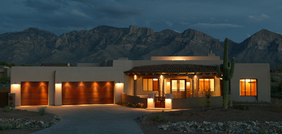 Inspiration for a mid-sized contemporary beige one-story stucco exterior home remodel in Phoenix