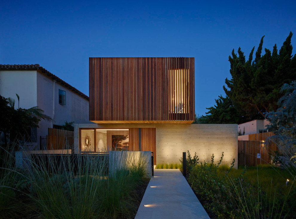 Idée de décoration pour une grande façade de maison grise minimaliste à un étage avec un revêtement mixte et un toit plat.