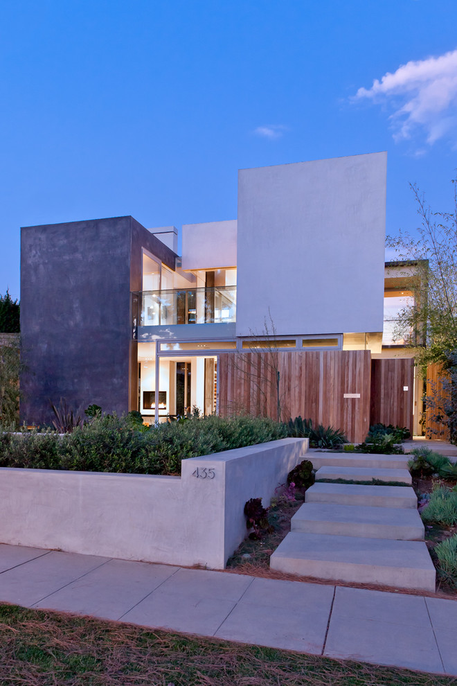 Inspiration for a large contemporary gray two-story mixed siding flat roof remodel in Los Angeles