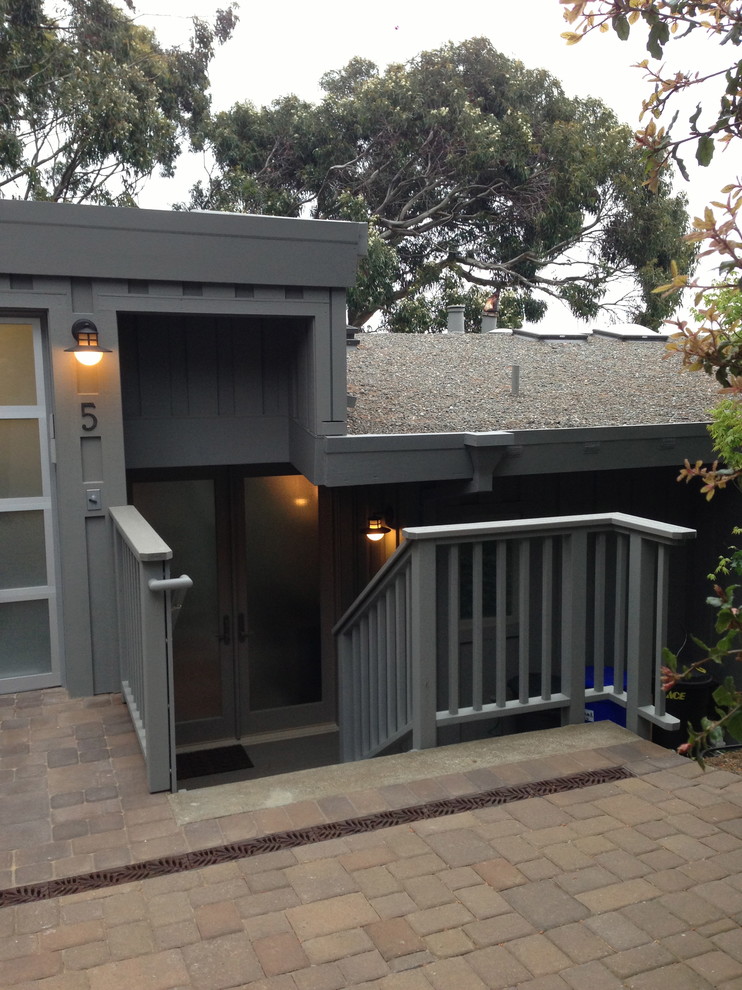 Design ideas for a gey contemporary house exterior in San Francisco with three floors and wood cladding.