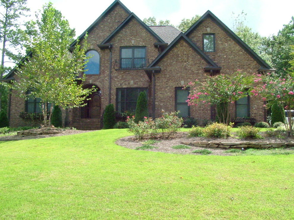 Inspiration for a large contemporary brown vinyl exterior home remodel in Birmingham