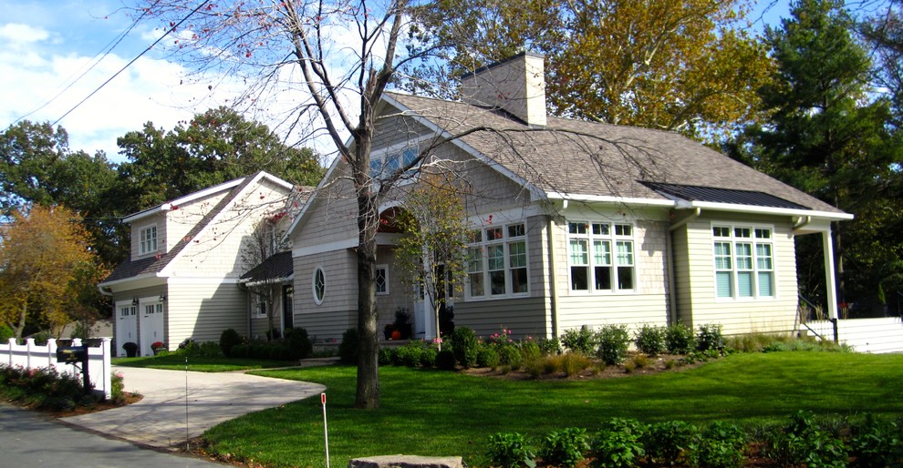 Inspiration for a large timeless beige two-story wood gable roof remodel in Baltimore