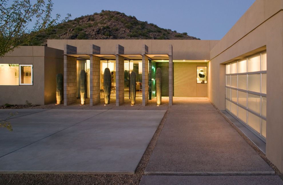 Inspiration for a modern stucco exterior home remodel in Phoenix