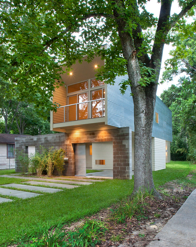 Contemporary two floor house exterior in New Orleans with metal cladding.