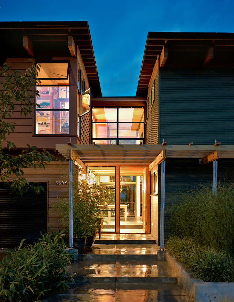 Inspiration for a contemporary house exterior in Portland with mixed cladding.