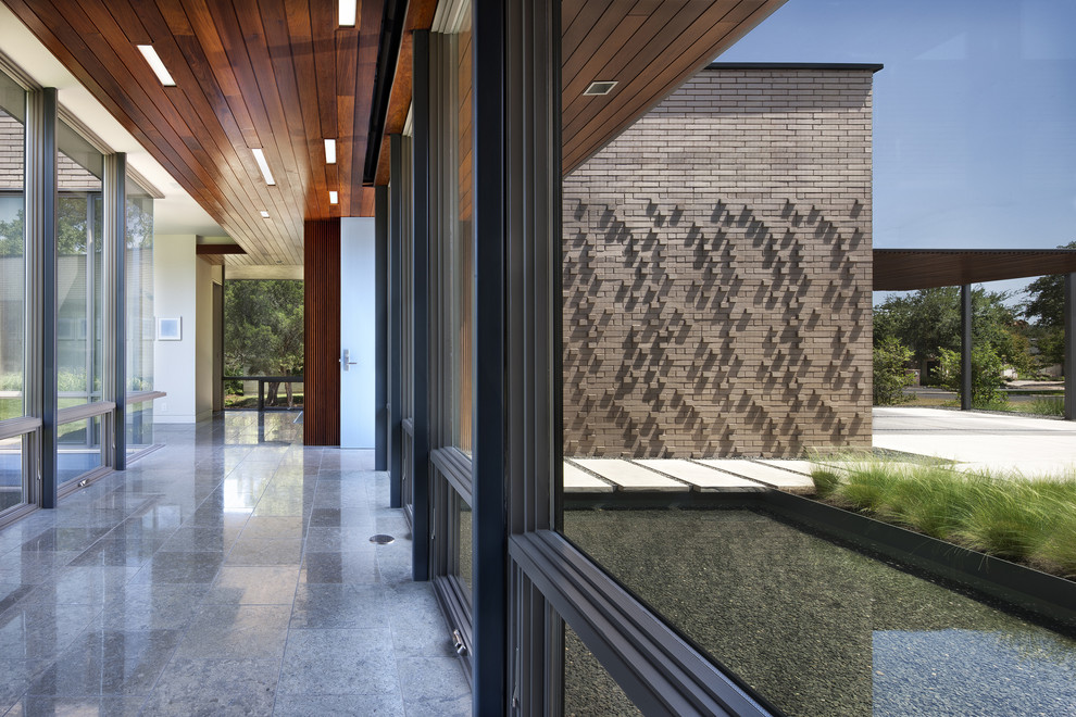 Design ideas for a modern brick house exterior in Austin.