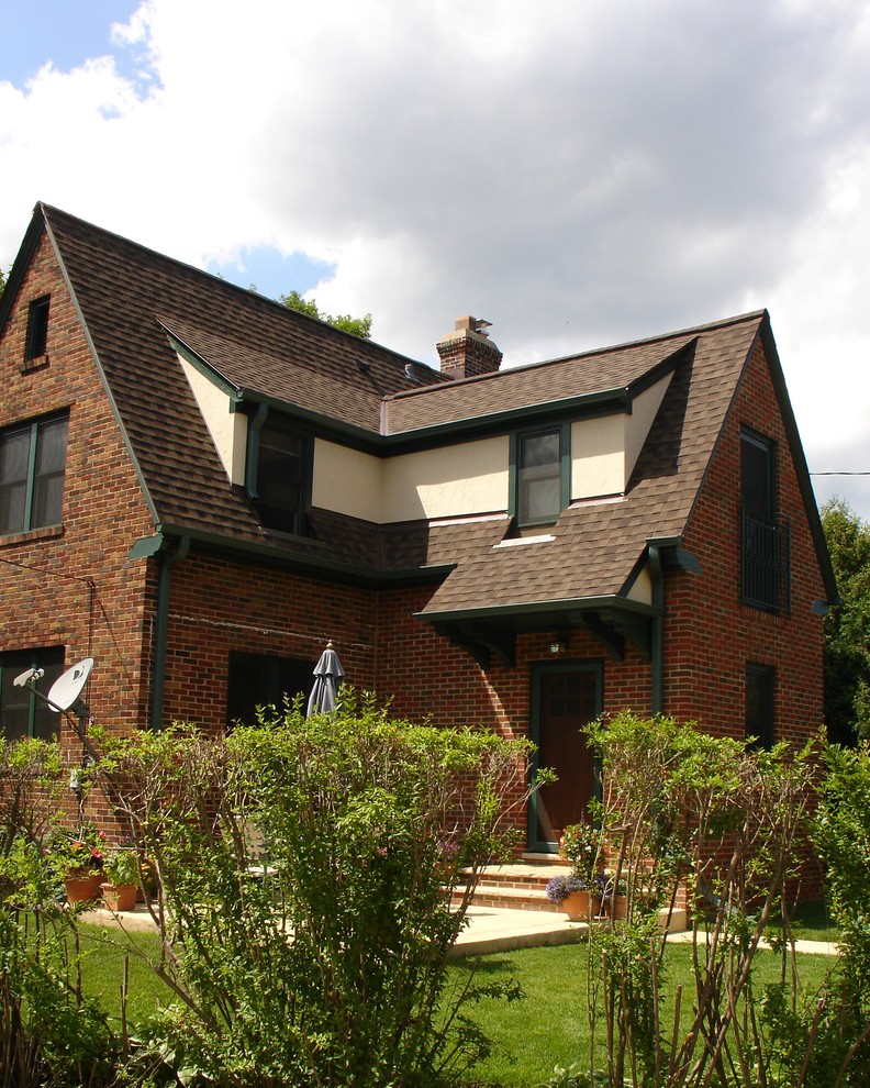Inspiration for a small timeless multicolored two-story brick exterior home remodel in Milwaukee with a shingle roof