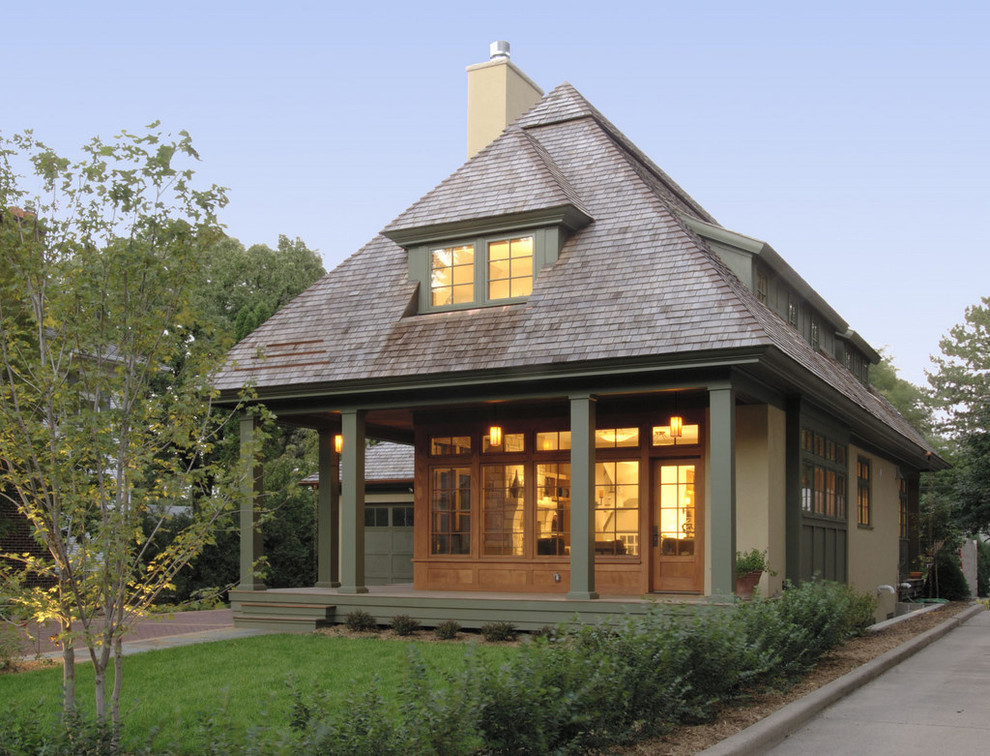 Inspiration for a mid-sized timeless two-story exterior home remodel in Minneapolis with a hip roof