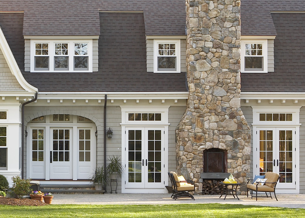 Large traditional gray two-story wood house exterior idea in Boston with a shingle roof