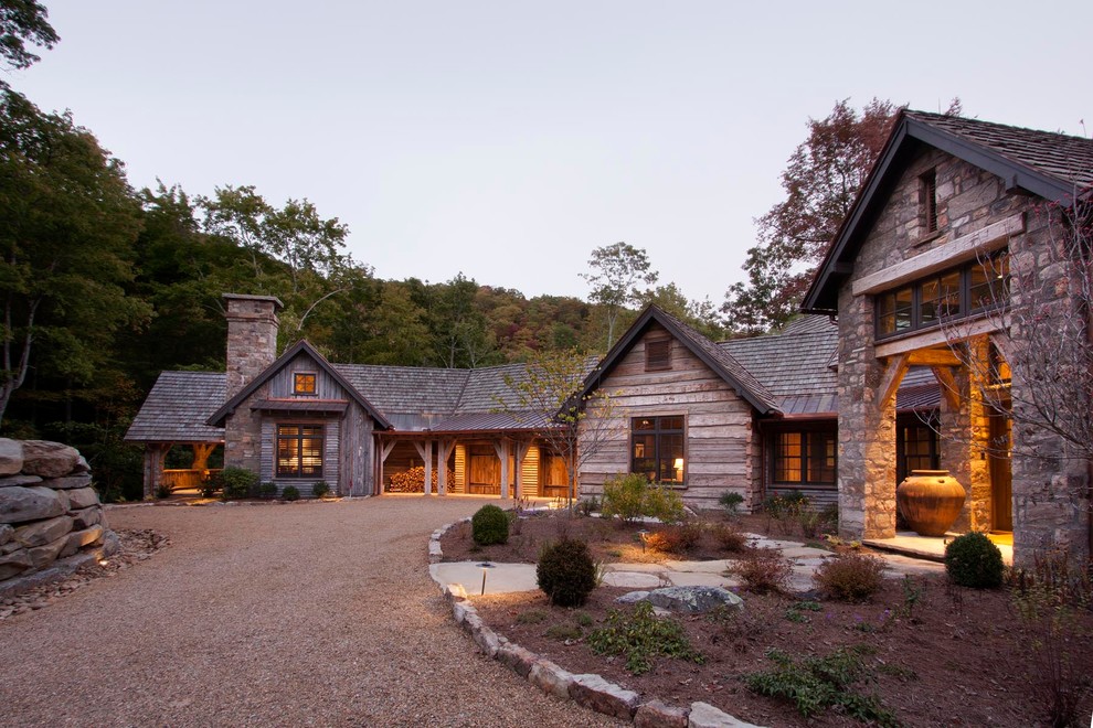 Example of a mountain style one-story wood exterior home design in Other