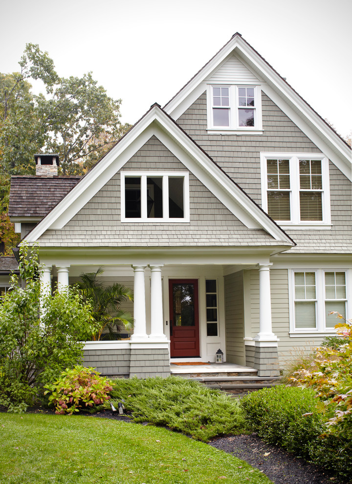 Elegant three-story gable roof photo in New York with a shingle roof