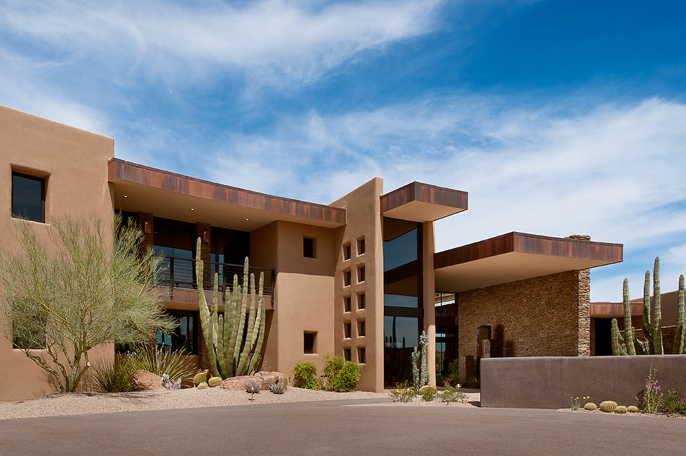 Example of a southwest two-story exterior home design in Phoenix